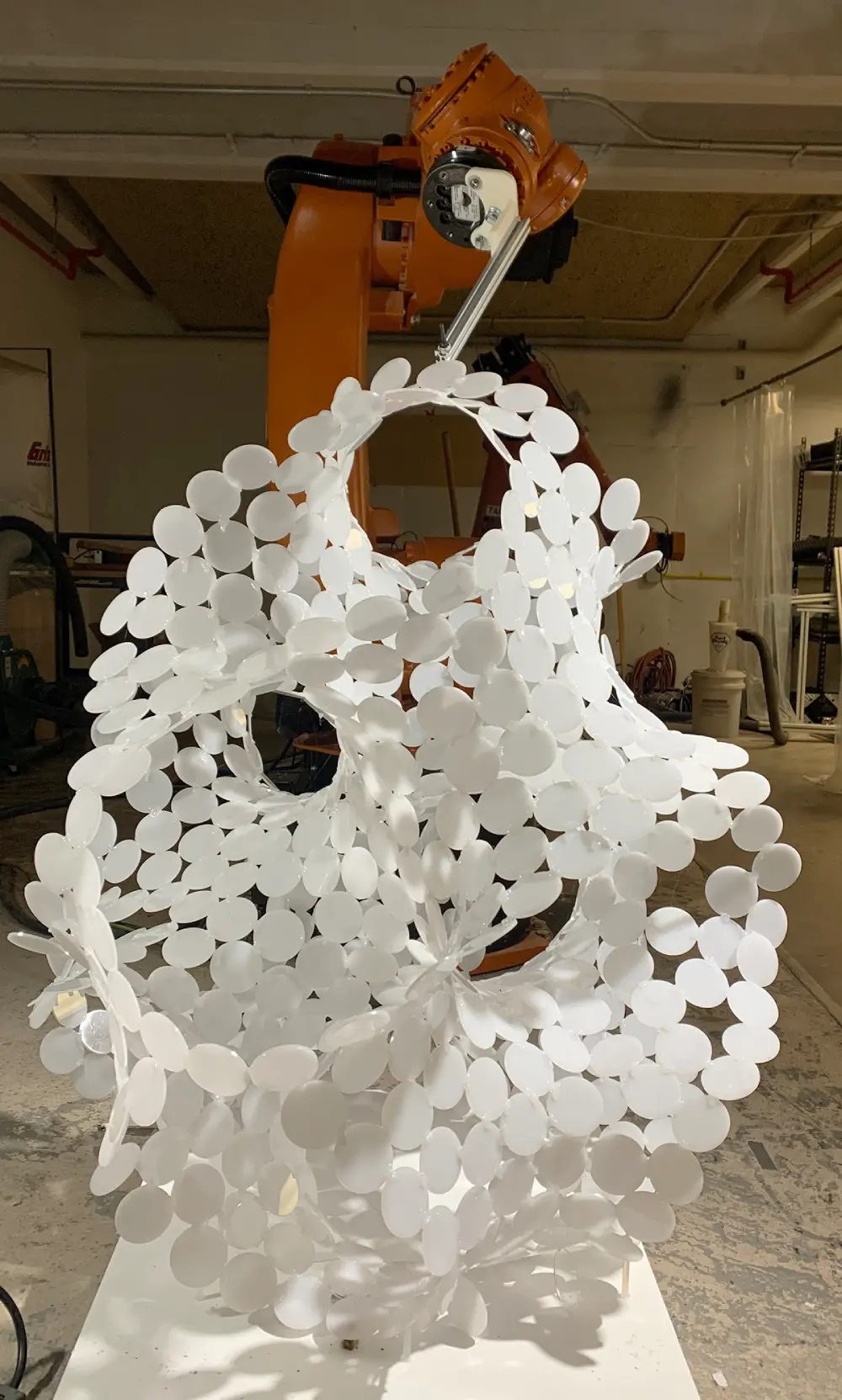 Cooperative Robotics Assembly; Gyroid egg, made out of laser cut acrylic discs Jonathan Malott, Austin Texas Architecture
